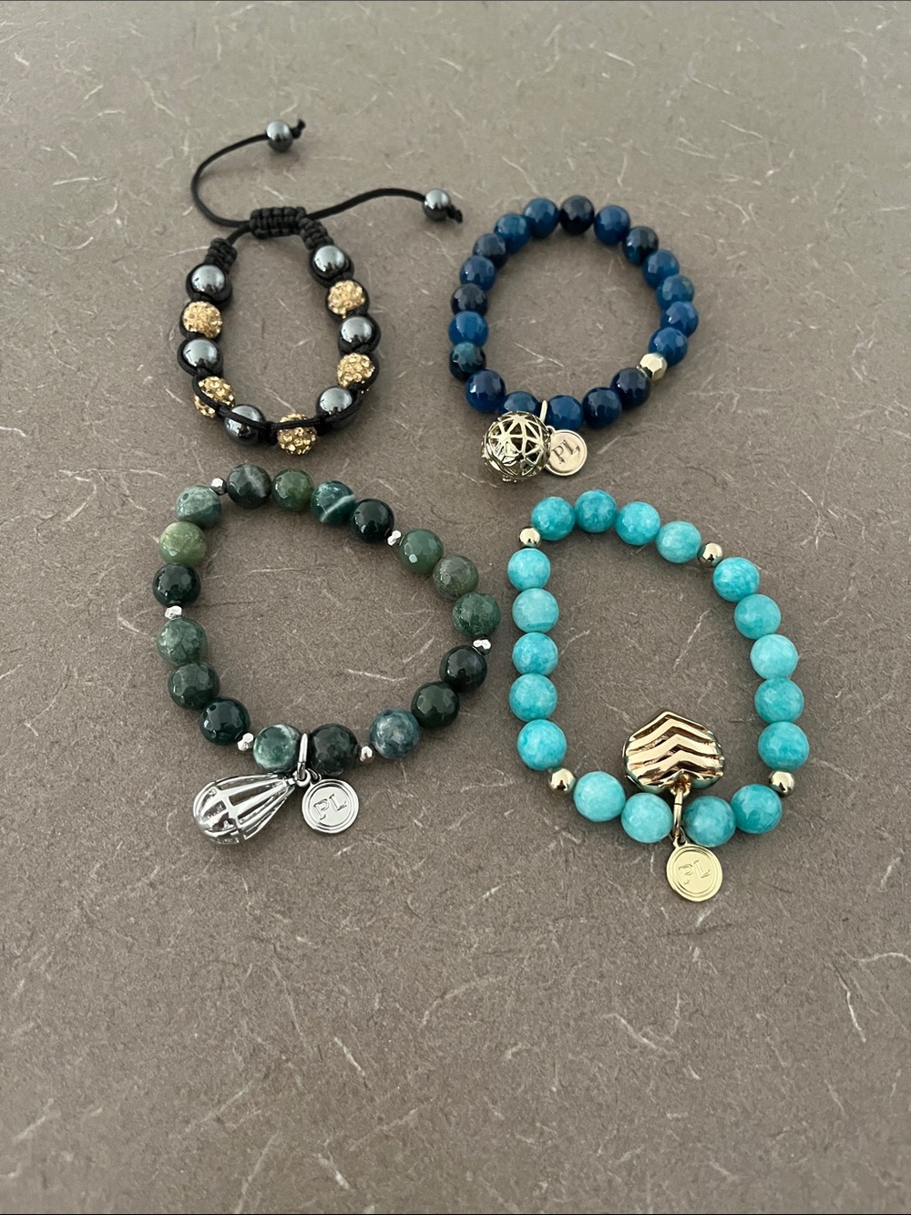 4 Bracelets- 3 PartyLite bracelets and one handmade.